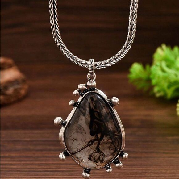 Jewelry - Elegant Silver Tone Pendant Necklace with Unique Stone Design
